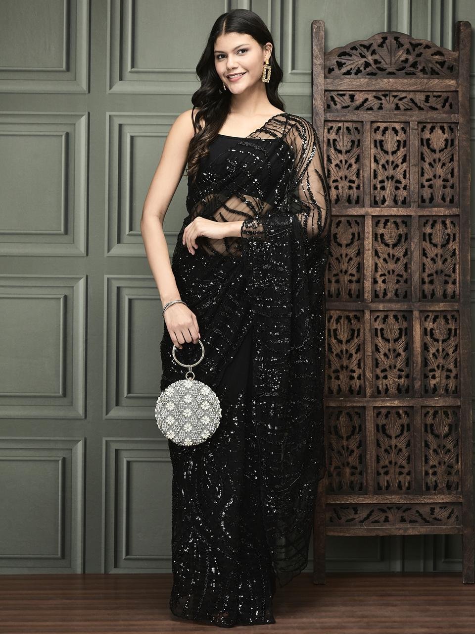 Black net saree with sequins and pearls